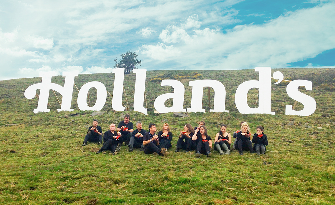 Hollands logo built on a hill in the style of the hollywood sign